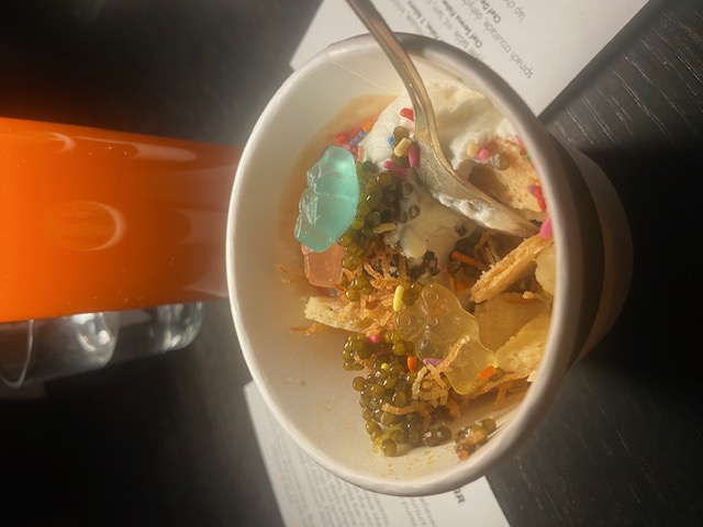 Truffle infused caviar topped ice cream sundae with colorful toppings, served as the final course at 7 Adams